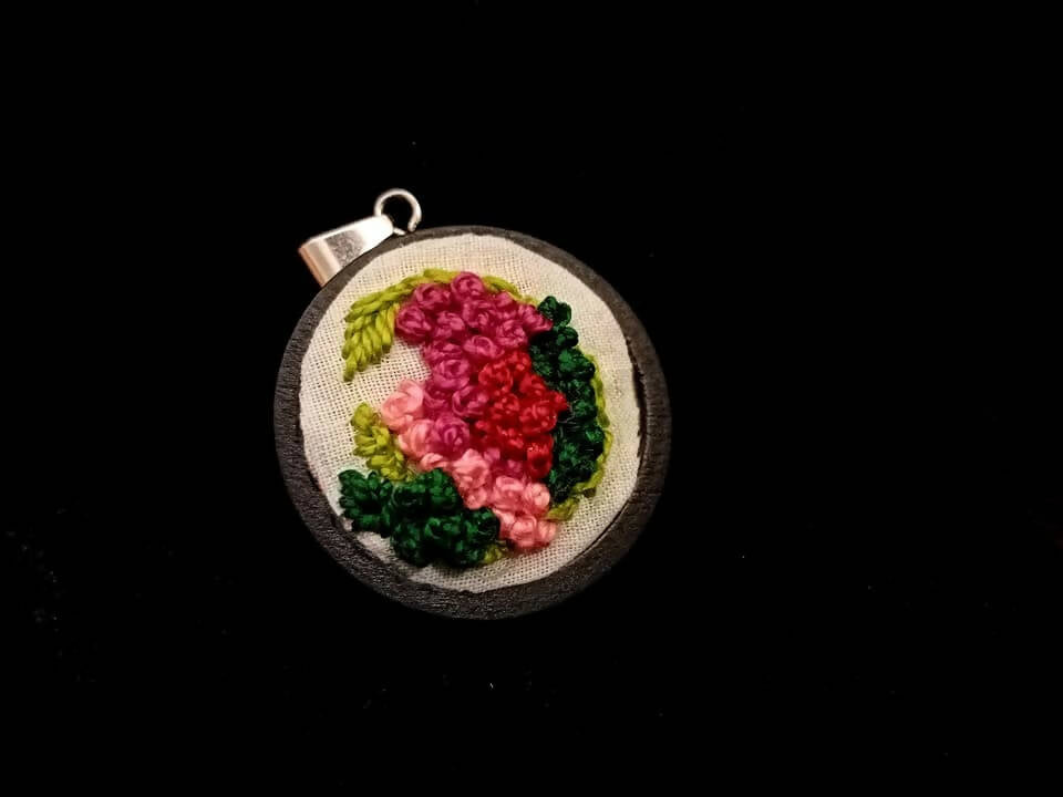 Embroidered Pendant (Cradling love)